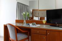 Televízia a/alebo spoločenská miestnosť v ubytovaní Best Western Plus Hotel Plaza