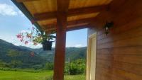 a window of a house with a view of a mountain at Yurte in Langa in Bosia