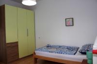 Posteľ alebo postele v izbe v ubytovaní Apartmani Palmas Rijeka