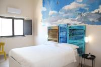A bed or beds in a room at Urban Pop Bnb
