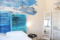 A bed or beds in a room at Urban Pop Bnb