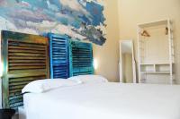 A bed or beds in a room at Urban Pop Bnb