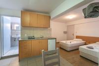 A bed or beds in a room at Kardamena Holiday Apartments