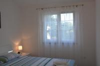 Posteľ alebo postele v izbe v ubytovaní Apartmani Gržinić