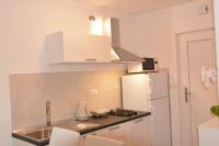 Kuchyňa alebo kuchynka v ubytovaní Apartmani Gržinić