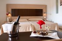 A bed or beds in a room at Hotel & SPA Dynastic