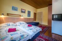 A bed or beds in a room at Chalupa LUKA Terchová