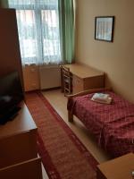 Łóżko lub łóżka w pokoju w obiekcie Grand Hotel