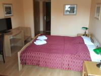 Łóżko lub łóżka w pokoju w obiekcie Grand Hotel