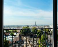 a view of a city from a balcony at Terrass&quot; Hotel in Paris