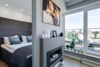 Posteľ alebo postele v izbe v ubytovaní Elite Apartments Chmielna Deluxe