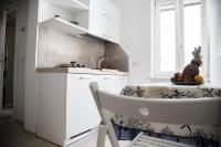 A kitchen or kitchenette at Tre Archi Apartment & Relais