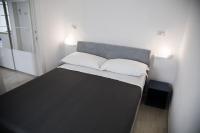 A bed or beds in a room at Tre Archi Apartment & Relais