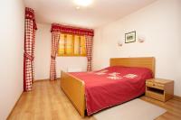 Postel nebo postele na pokoji v ubytování Aparthotel Snjezna Kraljica