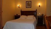 Postel nebo postele na pokoji v ubytování Hotel Rural Ovio