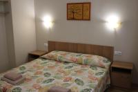 Postel nebo postele na pokoji v ubytování Hotel Radik