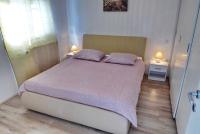 Posteľ alebo postele v izbe v ubytovaní Apartments Curicta 1