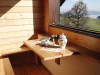 a small wooden table in a room with a window at Baby- und Kinderhof Aicherbauer in Seeham