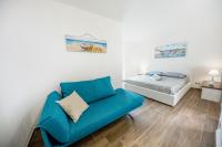 A bed or beds in a room at Marechiaro House