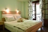 Łóżko lub łóżka w pokoju w obiekcie Hotel Manthos Blue