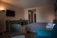 Televízia a/alebo spoločenská miestnosť v ubytovaní Plaza Beach Holiday House