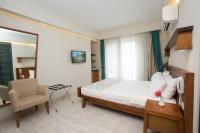 Postel nebo postele na pokoji v ubytování Dedeminn Marina Hotel