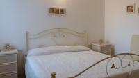 A bed or beds in a room at Il Fico d'India dell'Antico orto