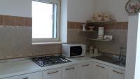 A kitchen or kitchenette at Il Fico d'India dell'Antico orto