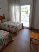 Postel nebo postele na pokoji v ubytování Live Salou Apartment