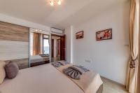 Postel nebo postele na pokoji v ubytování Apartcomplex Golden Bay