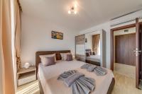 Postel nebo postele na pokoji v ubytování Apartcomplex Golden Bay