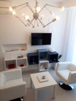 Televízia a/alebo spoločenská miestnosť v ubytovaní Alto Rooms and Apartments