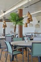 En restaurant eller et andet spisested på Beachrooms Pier 7