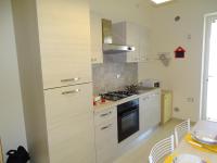 A kitchen or kitchenette at Linda Casa Vacanze