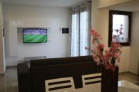 Televízia a/alebo spoločenská miestnosť v ubytovaní Villa Le Mimose