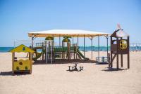 a group of playground equipment on the beach at Gold Bugaz Black Sea Hotel Group in Gribovka