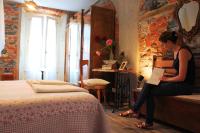 Postel nebo postele na pokoji v ubytování Le Dame Della Cortesella B&B