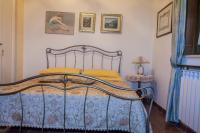 A bed or beds in a room at B&B Villa Carmen