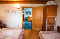 A bed or beds in a room at Aquapark Tatralandia chatka 118