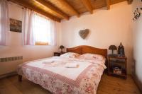A bed or beds in a room at Aquapark Tatralandia chatka 118