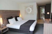 Ein Bett oder Betten in einem Zimmer der Unterkunft Sanadome Hotel & Spa Nijmegen