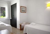 A bed or beds in a room at Apartaments Beach & Golf Resort
