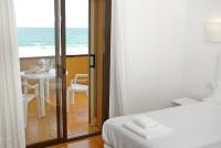 A bed or beds in a room at Apartaments Beach & Golf Resort