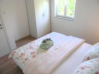 Postel nebo postele na pokoji v ubytování Apartman Danijel