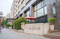 a wall with an umbrella in front of a building at Beitou Sweet Me Hot Spring Resort in Taipei