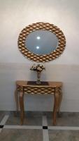 a table with a round mirror on top of it at Ideal city in Tutin