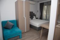 A bed or beds in a room at Amalia Rooms Sea View