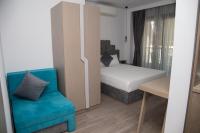 A bed or beds in a room at Amalia Rooms Sea View