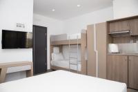 A bed or beds in a room at Amalia Rooms Sea View