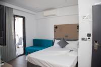 A bed or beds in a room at Amalia Rooms Sea View